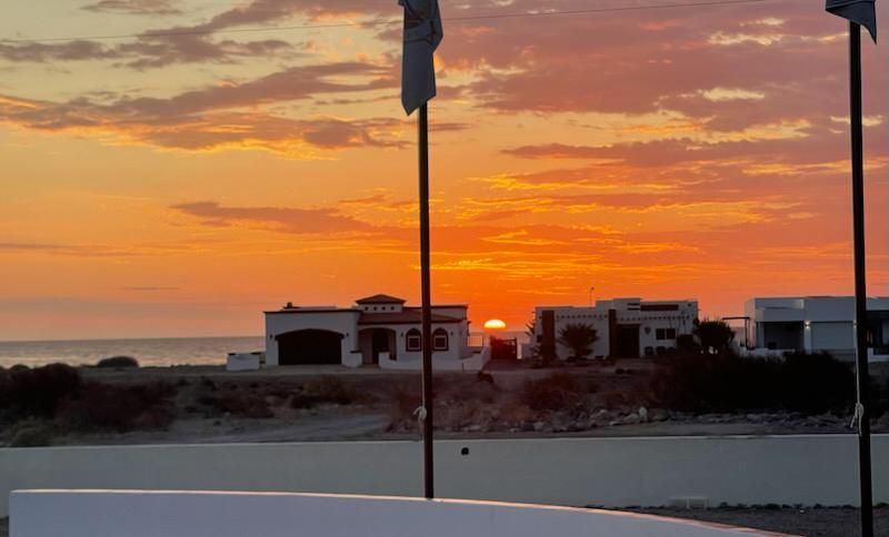 Rancho Costa Verde clubhouse and palm-lined courtyard at dusk, Baja California