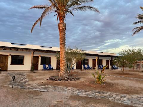 Palm-shaded casitas with patios at Rancho Costa Verde, Baja California